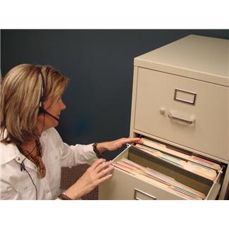 Woman Searching File Cabinet